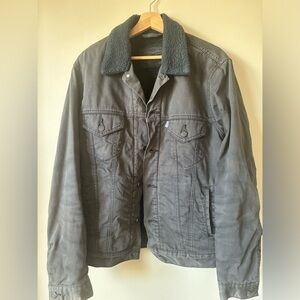 Men’s Levi’s classic trucker jacket in dark grey. Used